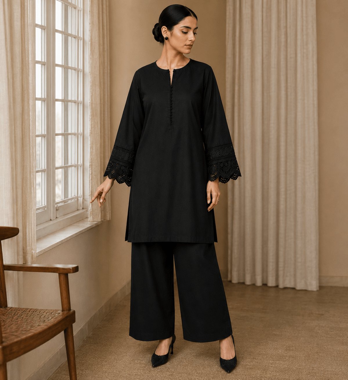 Black cotton lawn button-down kurta with lace cuffs paired with palazzo – front view