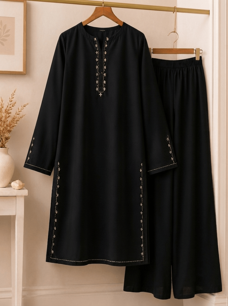Black front placket embroidered cotton lawn kurta and palazzo suit on hanger